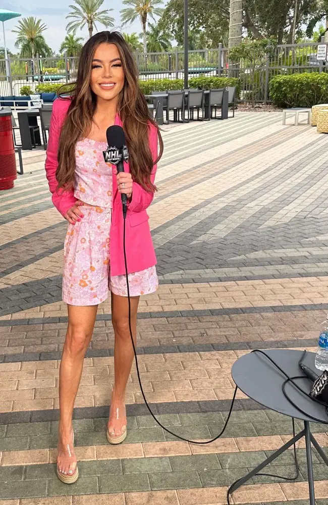 Jackie looking pretty in a pink floral outfit.