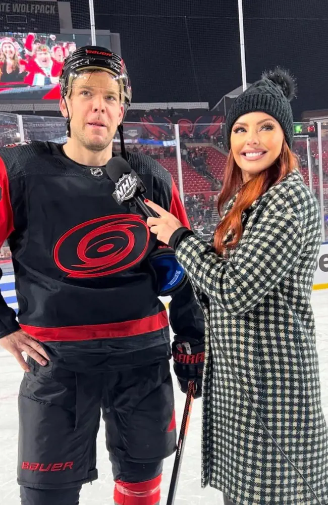 Lauren interviewing hockey player at Raleigh, North Carolina.