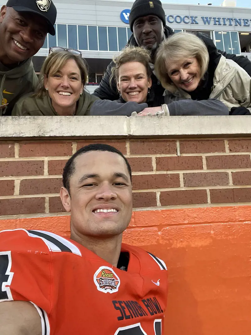 Andre II with Andre Sr., Melissa, and other kin during the Senior Bowl.