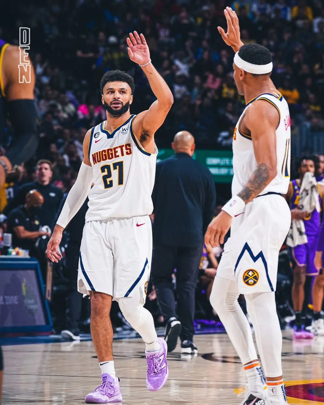 Jamal Murray and Bruce Brown Jr. of the Denver Nuggets going for a high five after grabbing points against Lakers on 10 Jan 2023 in Ball Arena [Credit: Denver Nuggets Instagram page]