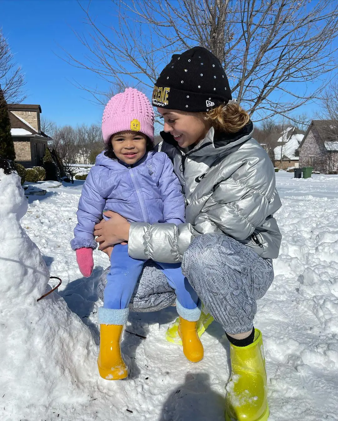 Dixon and her baby enjoying snow in Arkansas.