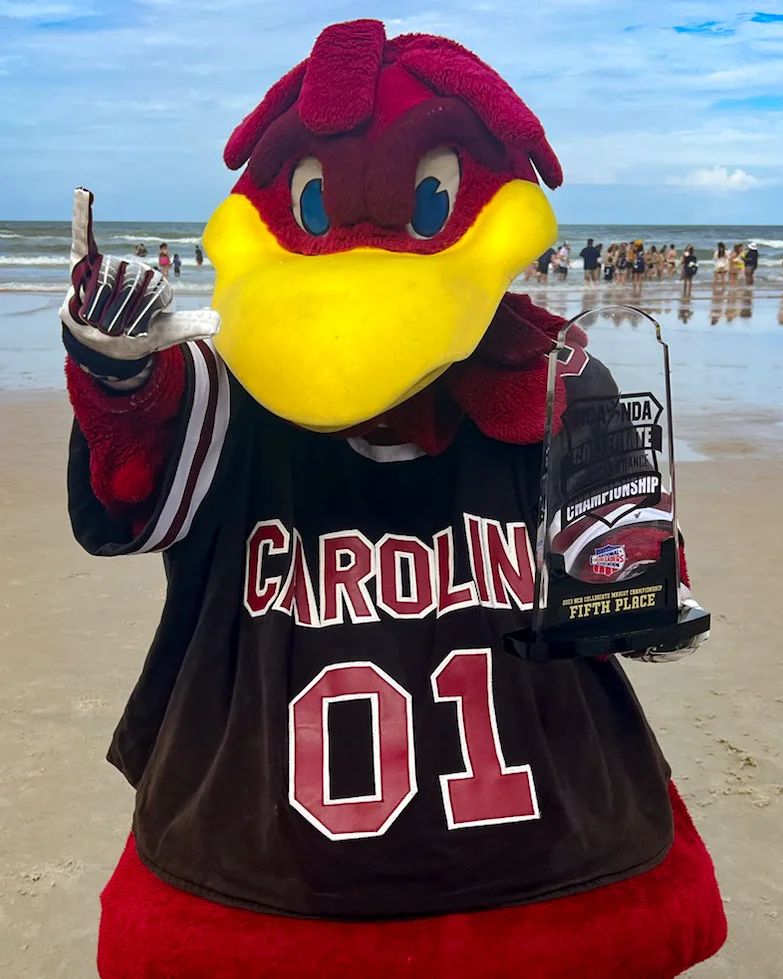 Cocky holding the trophy at Columbia on April 9, 2023.