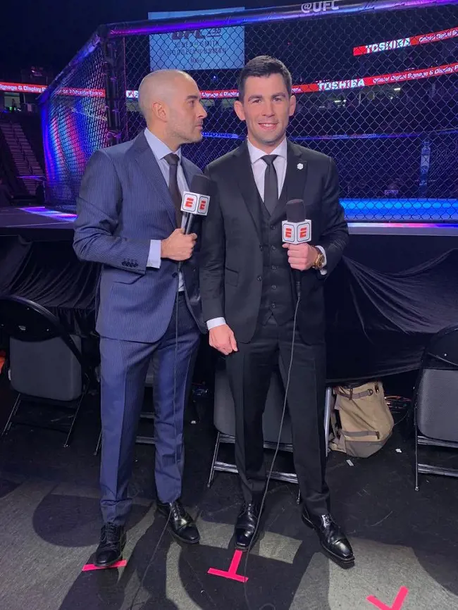 Cruz (right) with Joe Anik at the set of UFC for ESPN in 2019.