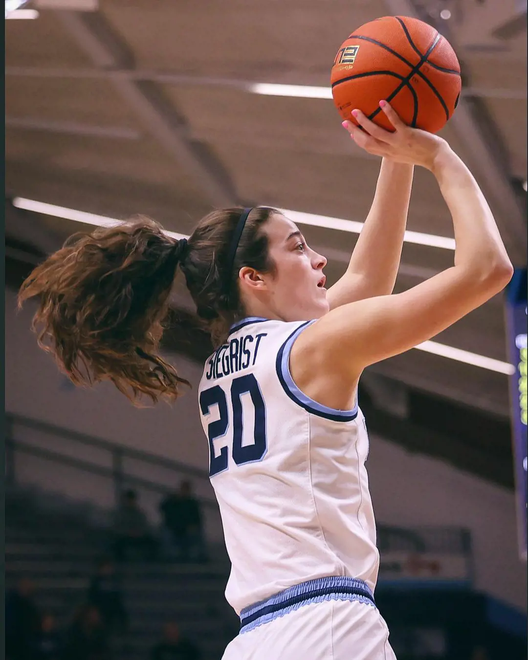 Maddy Siegrist trying to dunk during an NCAA Tournament in February 2023