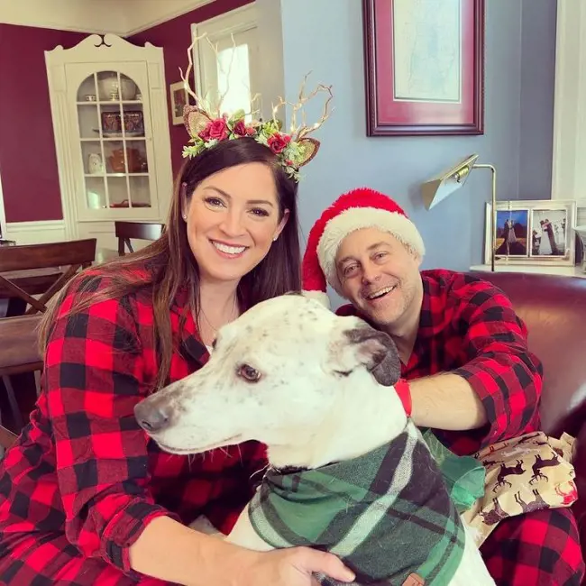 The ESPN host with her hubby during Christmas Celebration on 26 December 2022 with their dog Fletcher.