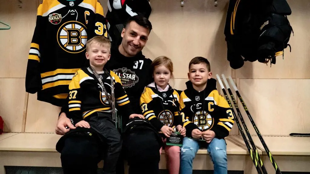 Patrice with his two sons and a daughter in the Accuracy Shooting event at the NHL All-Star Skills Competition.