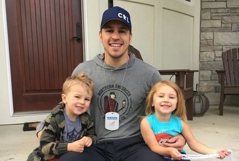 Zach with his twins Jaxson and Emelia before they go out for swimming in May 2017