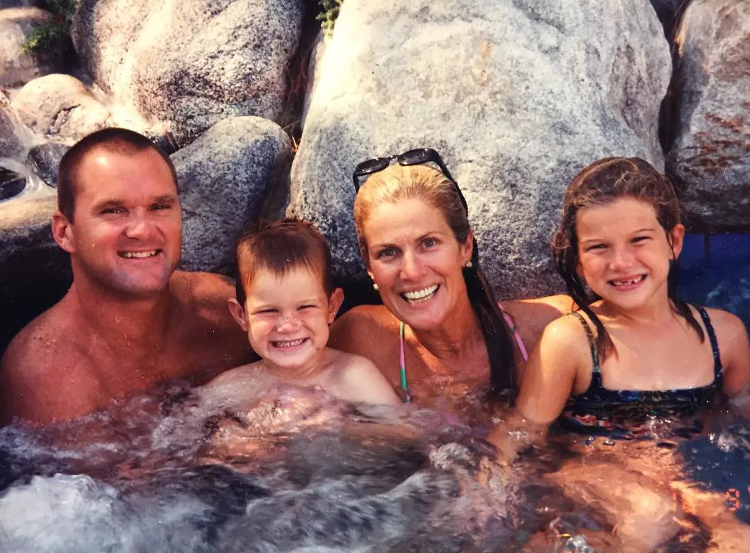 Little Sam and his tight-knit household, Chris, Mike and Franki swimming 