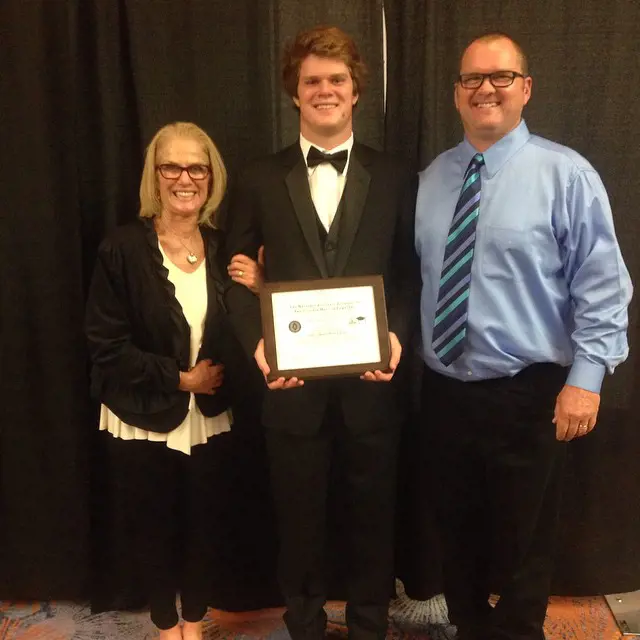 Sam with his mum Chris (on the left) and dad Michael (on the right) in 2015 when he joined USC