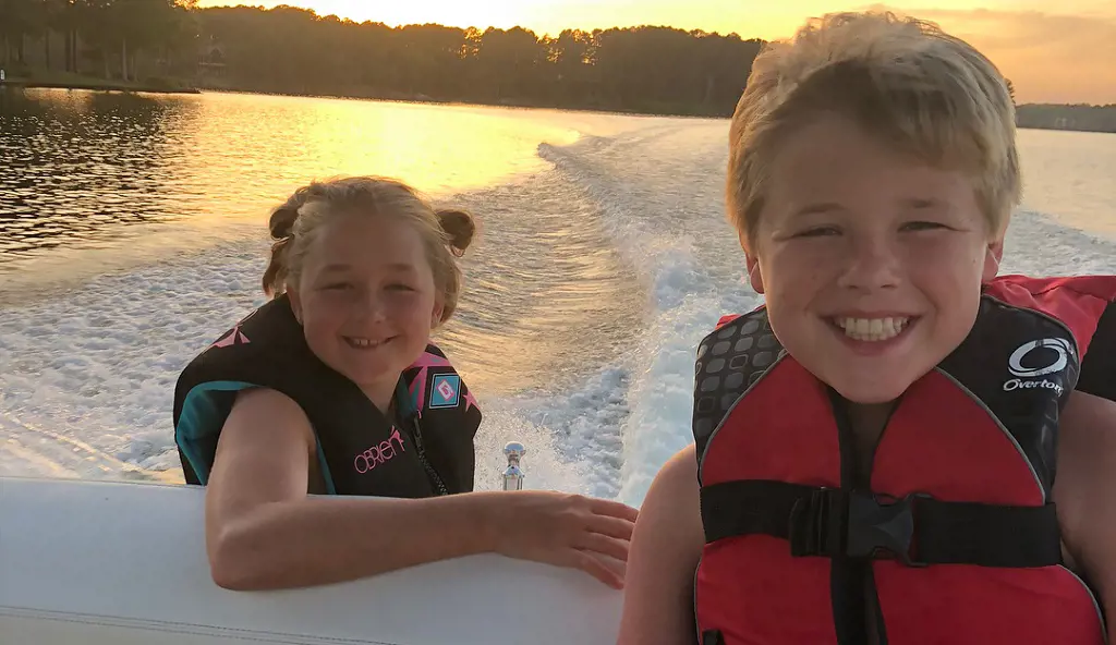 Julia enjoying with her brother in the beach.