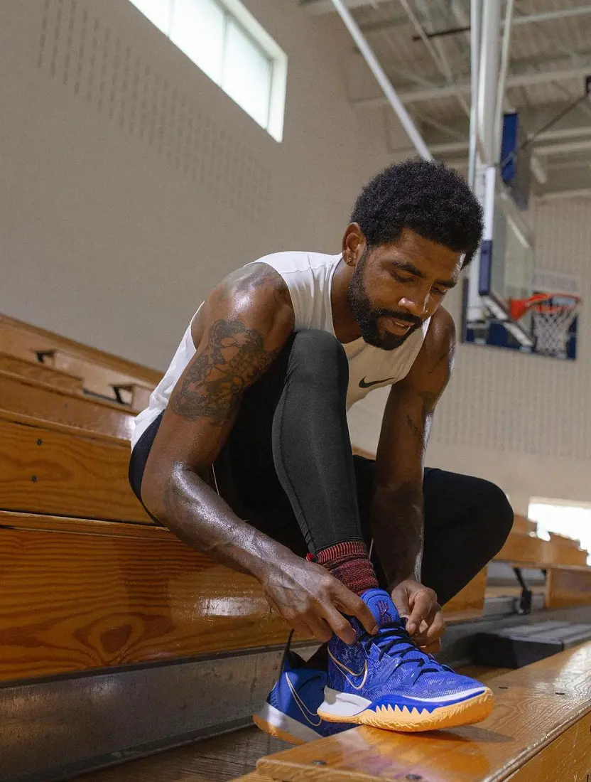 Irving getting ready lacing his Nike shoe back in November 2020