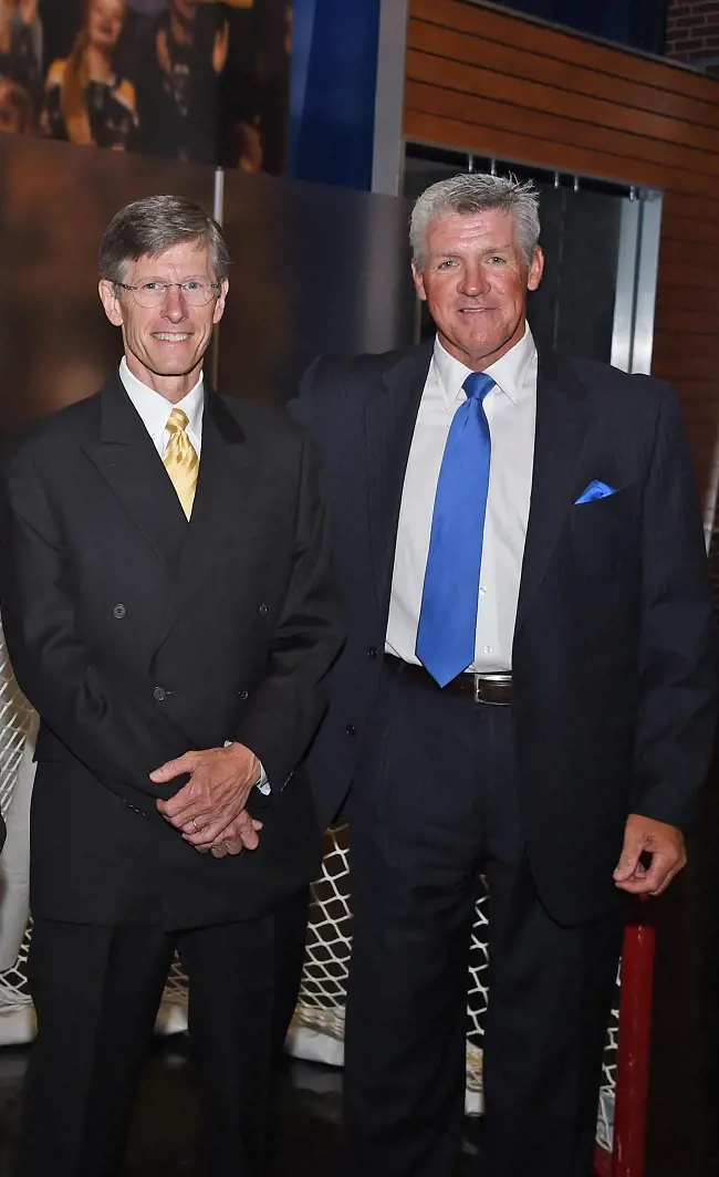 Edwards (left) with Brickley during an NHL event.