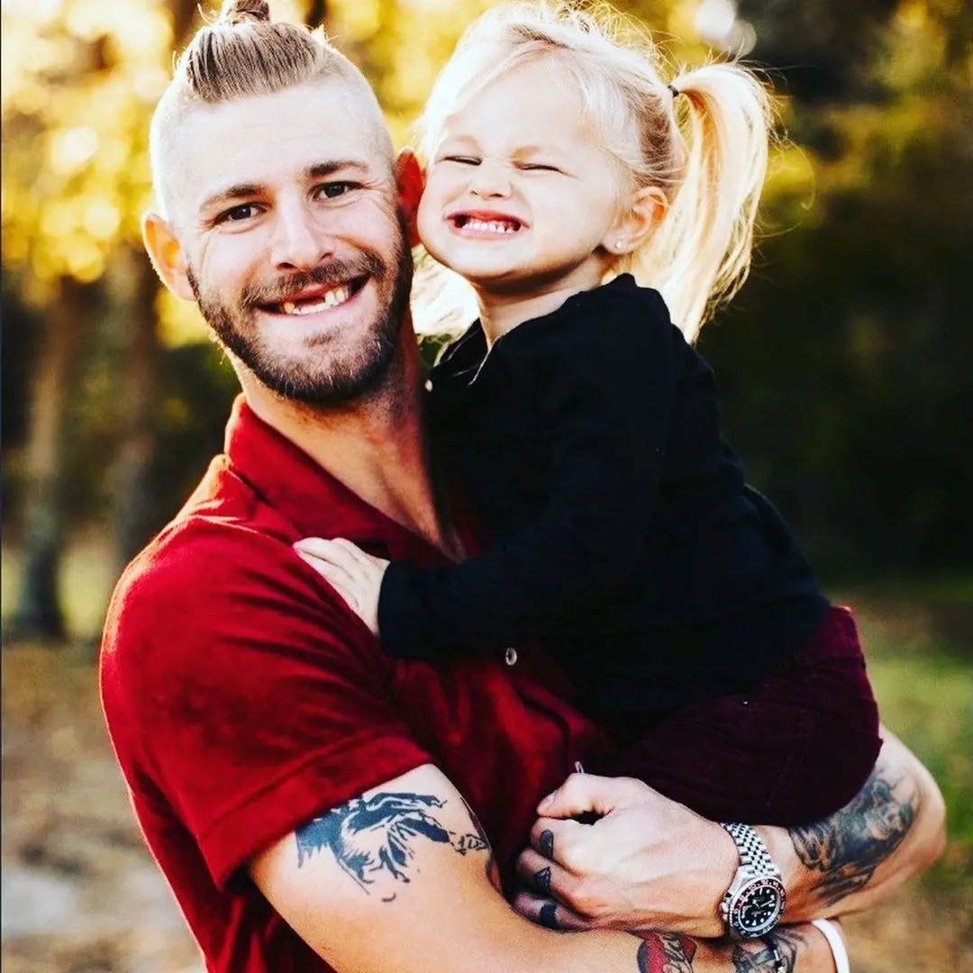 Austin with his daughter Olivia proudly showcasing their denticle in April 2021.