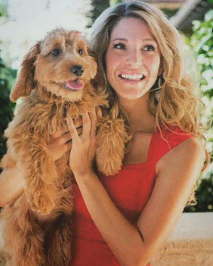 Jillian holding her puppy Penny on National Dog Day in August 2016