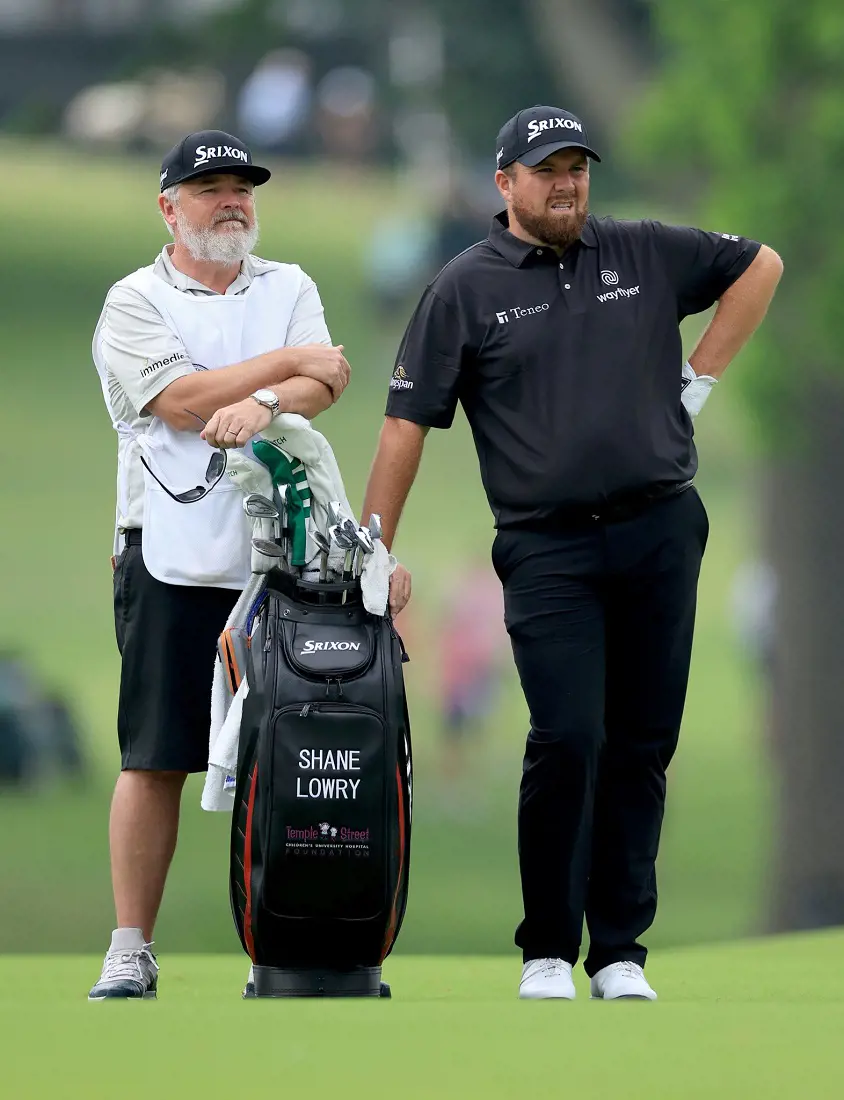 Shane Lowry (R) stands beside his caddie during the Fedex in August 2022