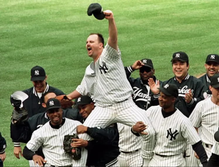 David Wells gets carried by his teammates after pitching a perfect game in 1998