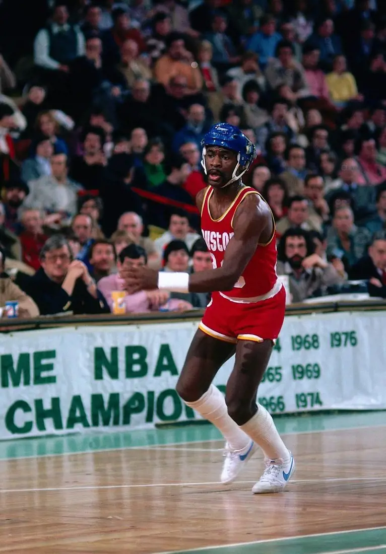 Calvin Murphy playing with a helmet on during a 1980s NBA game