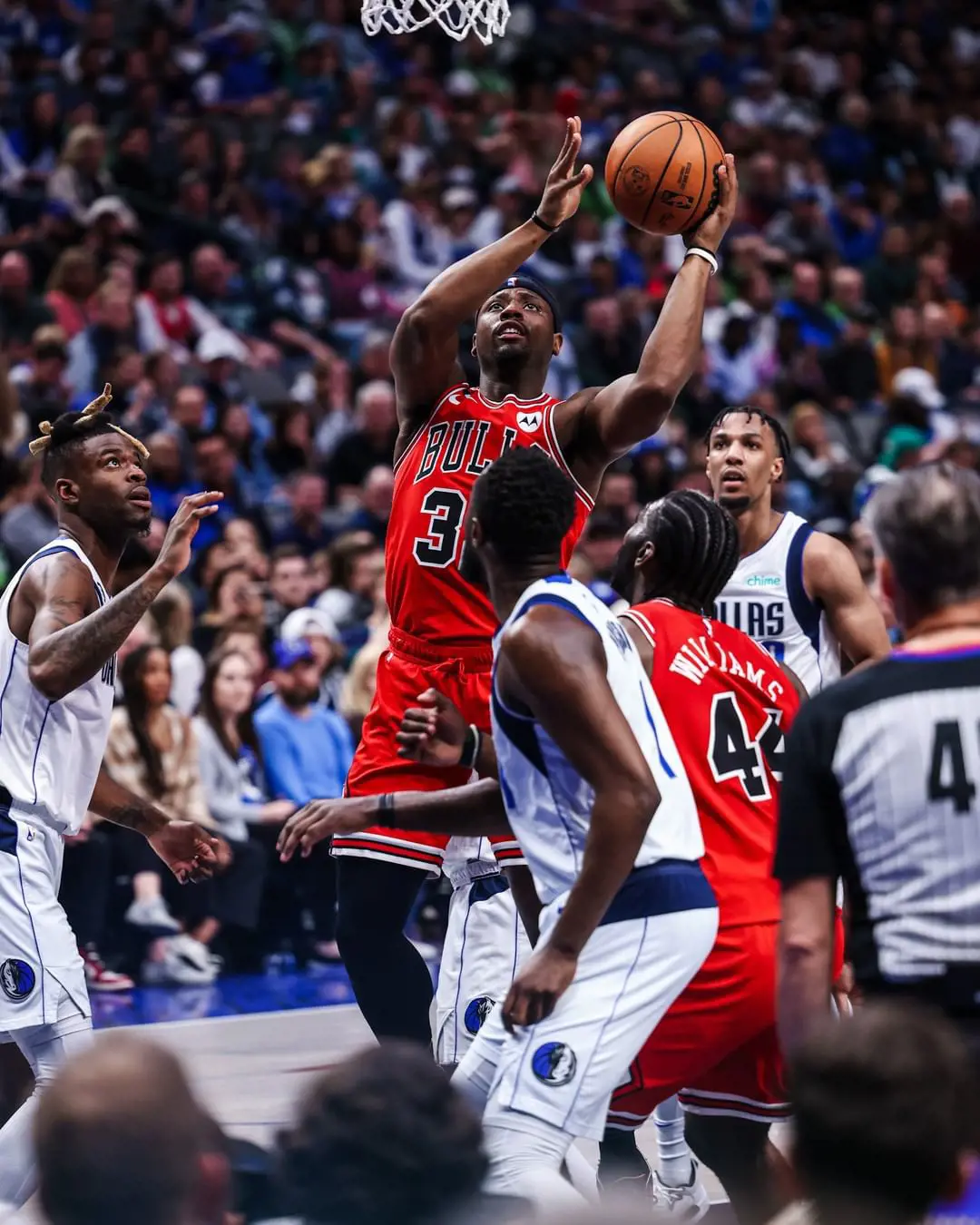 Chicago Bulls' Terry Taylor leaps high to score against Dallas Mavericks in April 2023