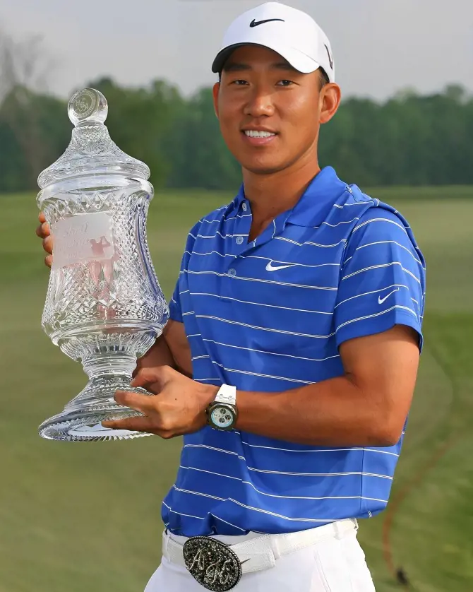 Anthony holding the 2010 Houston Open Trophy.