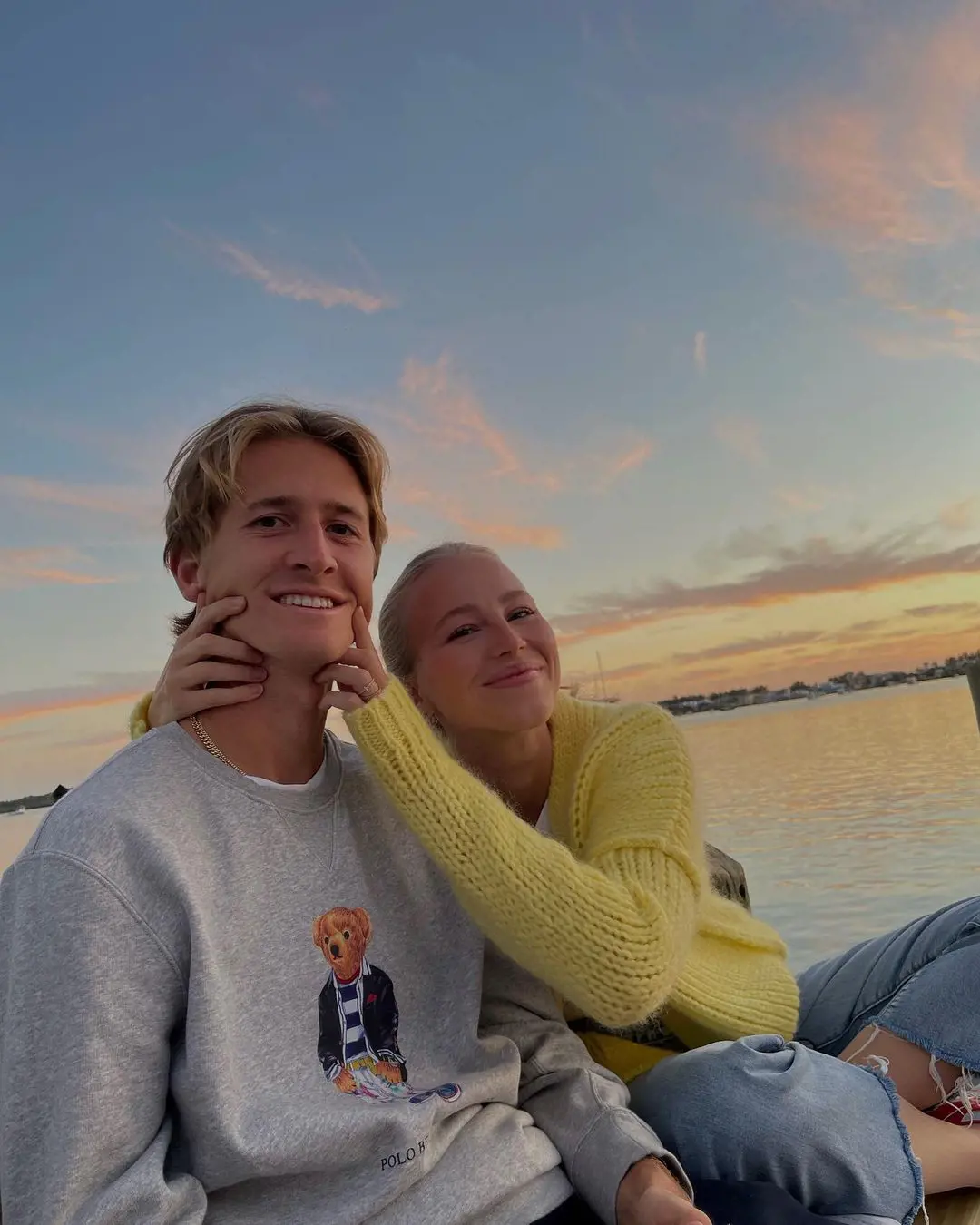 Ivana pinching her hubby Sebastian cheeks to make a smile on his face for the camera at Anna Marie Island, Florida in March 2022