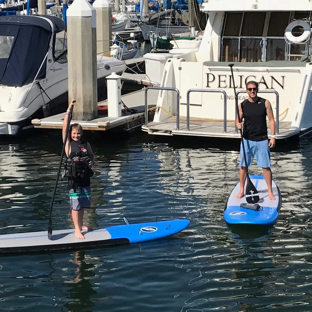 Kevin and Logan having fun with paddle boarding in 2017.