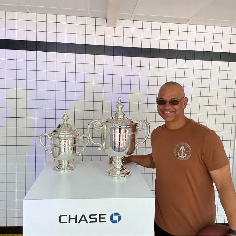 Joey smiles while taking picture with the championship trophy.