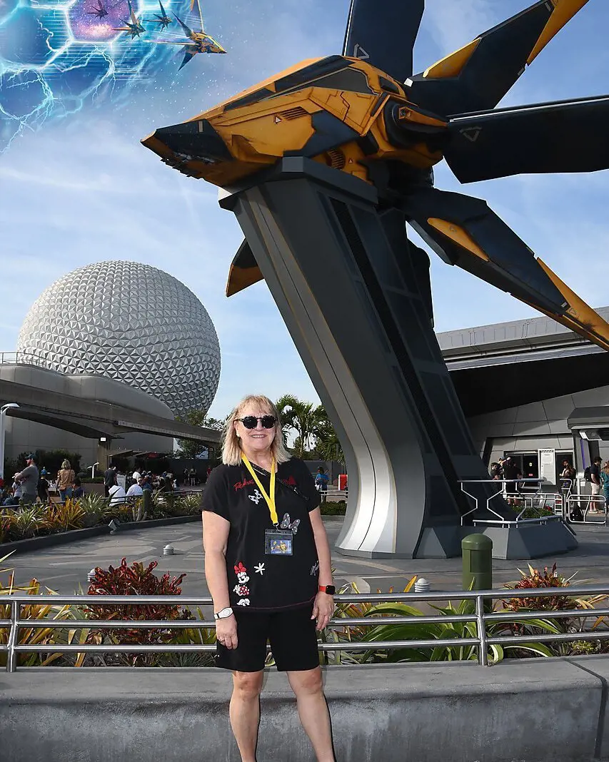 Donna standing in front of the Spaceship Earth at a theme park at Walt Disney World Resort in Florida, January 2023