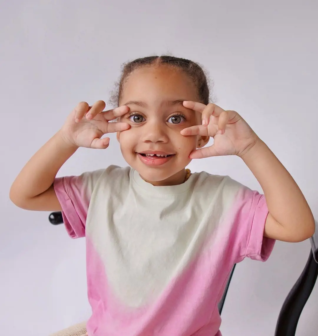 Bloom looking adorable in her white and pink dyed shirt's portrait posted in August 2022