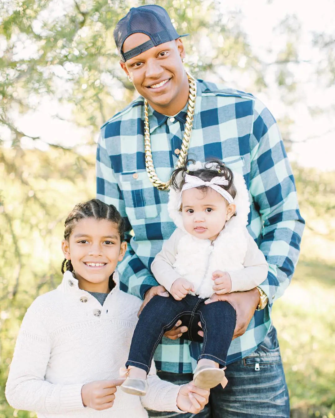 Charlie, Alliyah and CJ posing for a portrait in November 2016