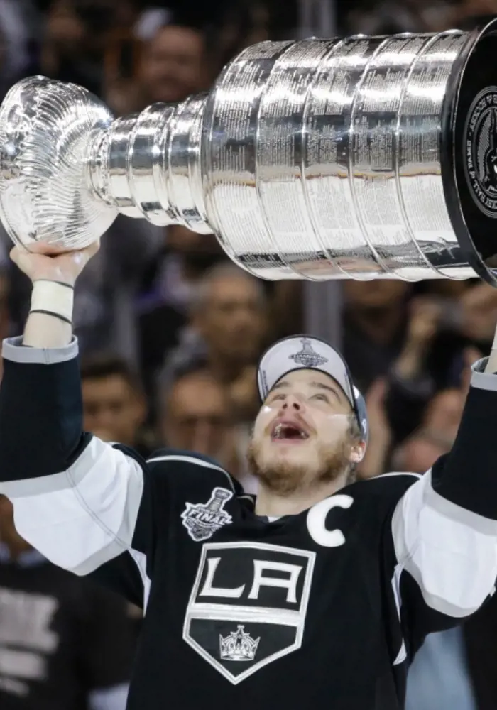 LA Kings right wing Dustin Brown raising the 2014 championship. 