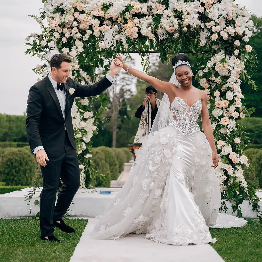 Inem looked gorgeous in a white gown, and Adam looked smart in a black suit.