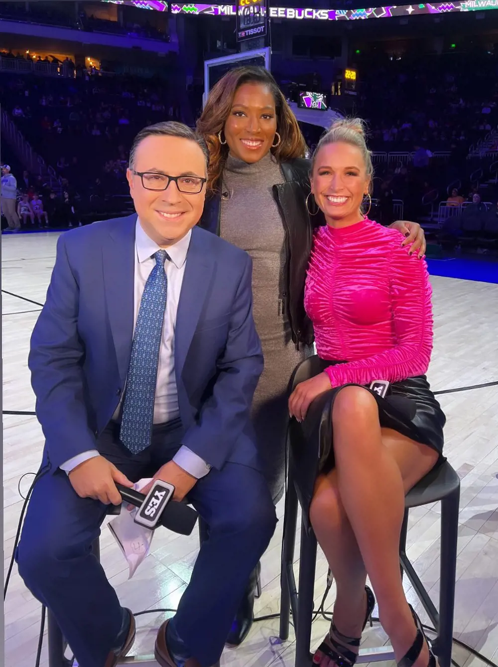 Eagle, Triplett, and Kustok (from left to right) at courtside for the Nets game.